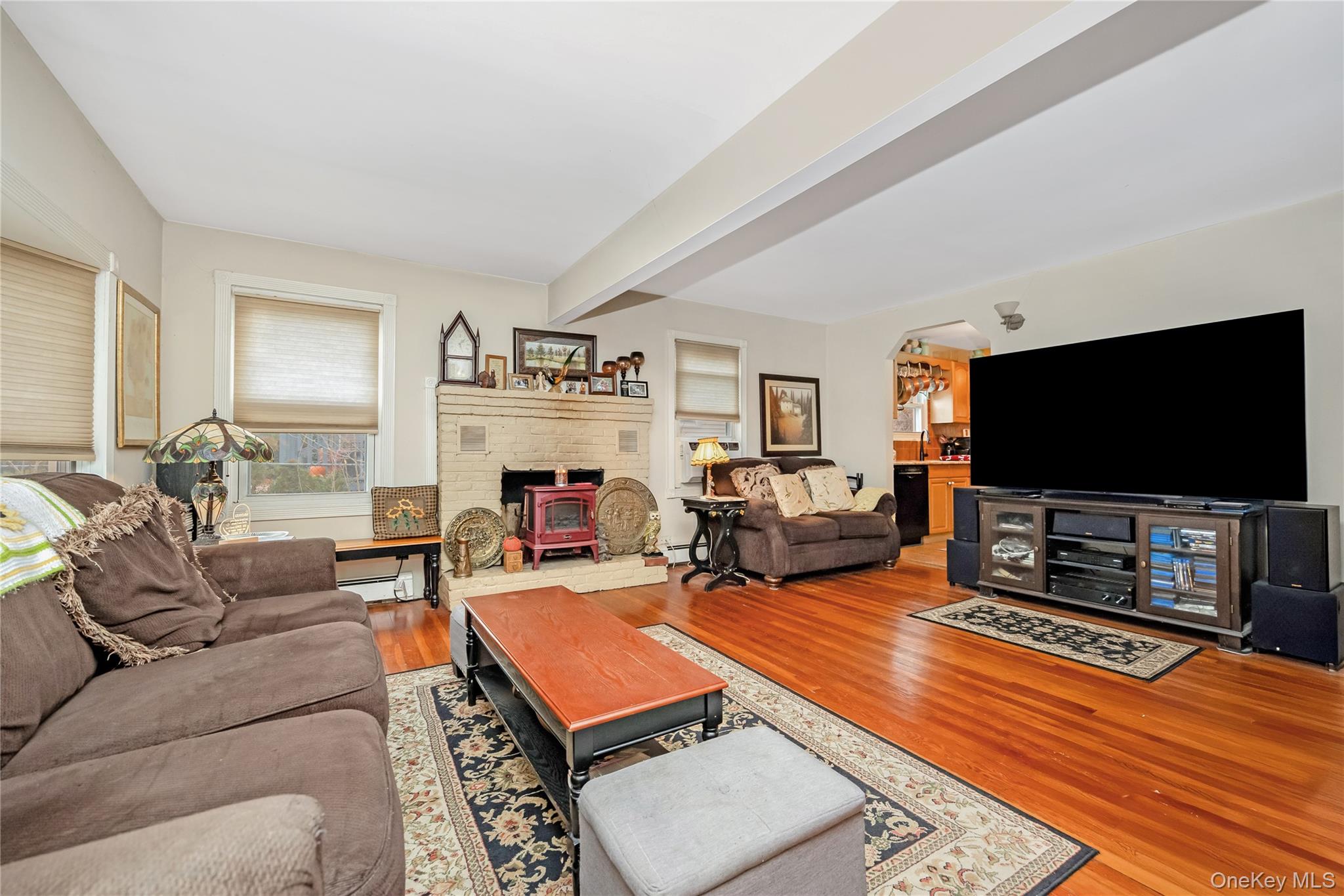 180 Lakeside Trail Ridge, NY 11961 - Photo 12 of 22 a living room with furniture and a flat screen tv