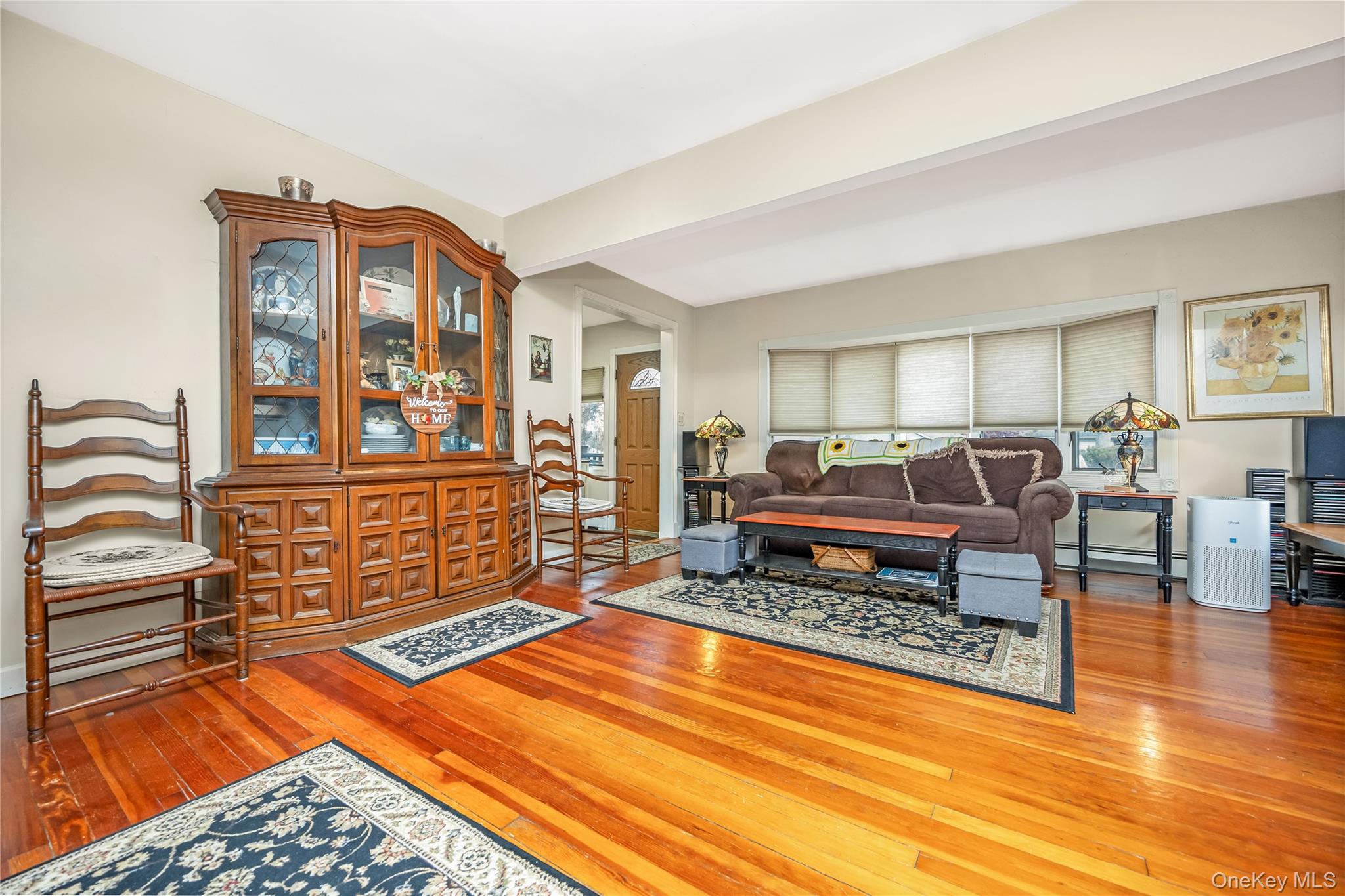 180 Lakeside Trail Ridge, NY 11961 - Photo 13 of 22 a living room with furniture rug and wooden floor