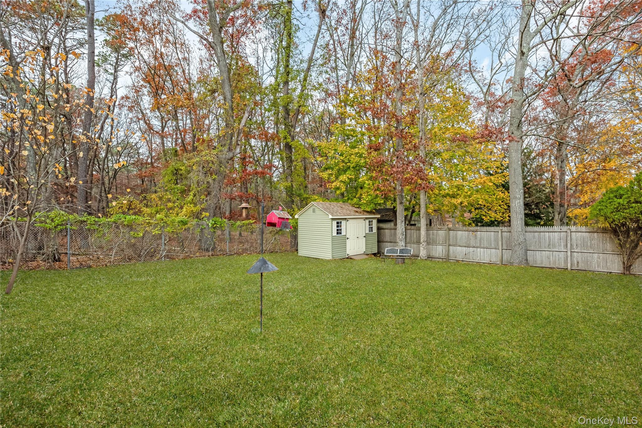 180 Lakeside Trail Ridge, NY 11961 - Photo 20 of 22 a view of a back yard
