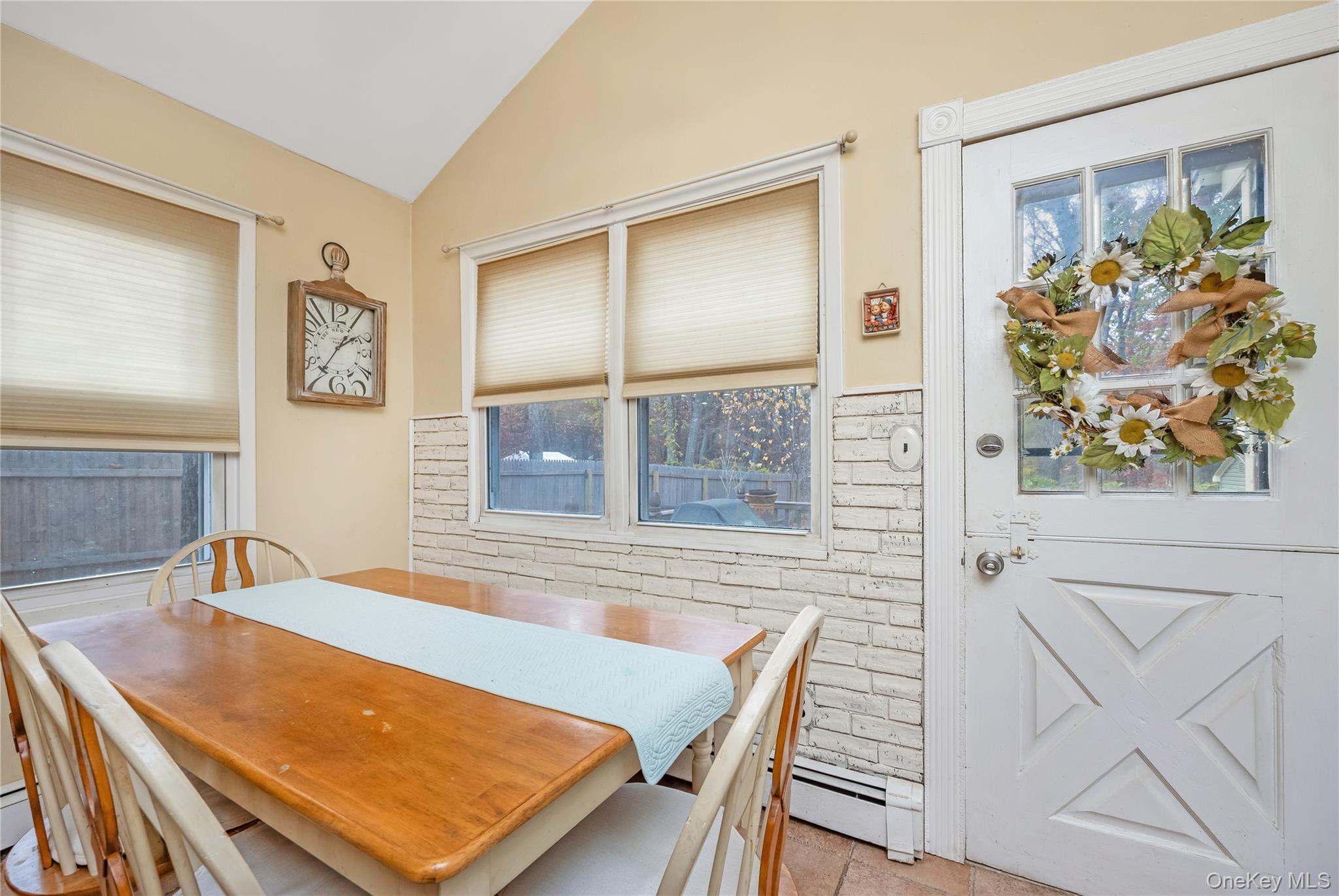 180 Lakeside Trail Ridge, NY 11961 - Photo 7 of 22 a view of a dining room with furniture and a potted plant
