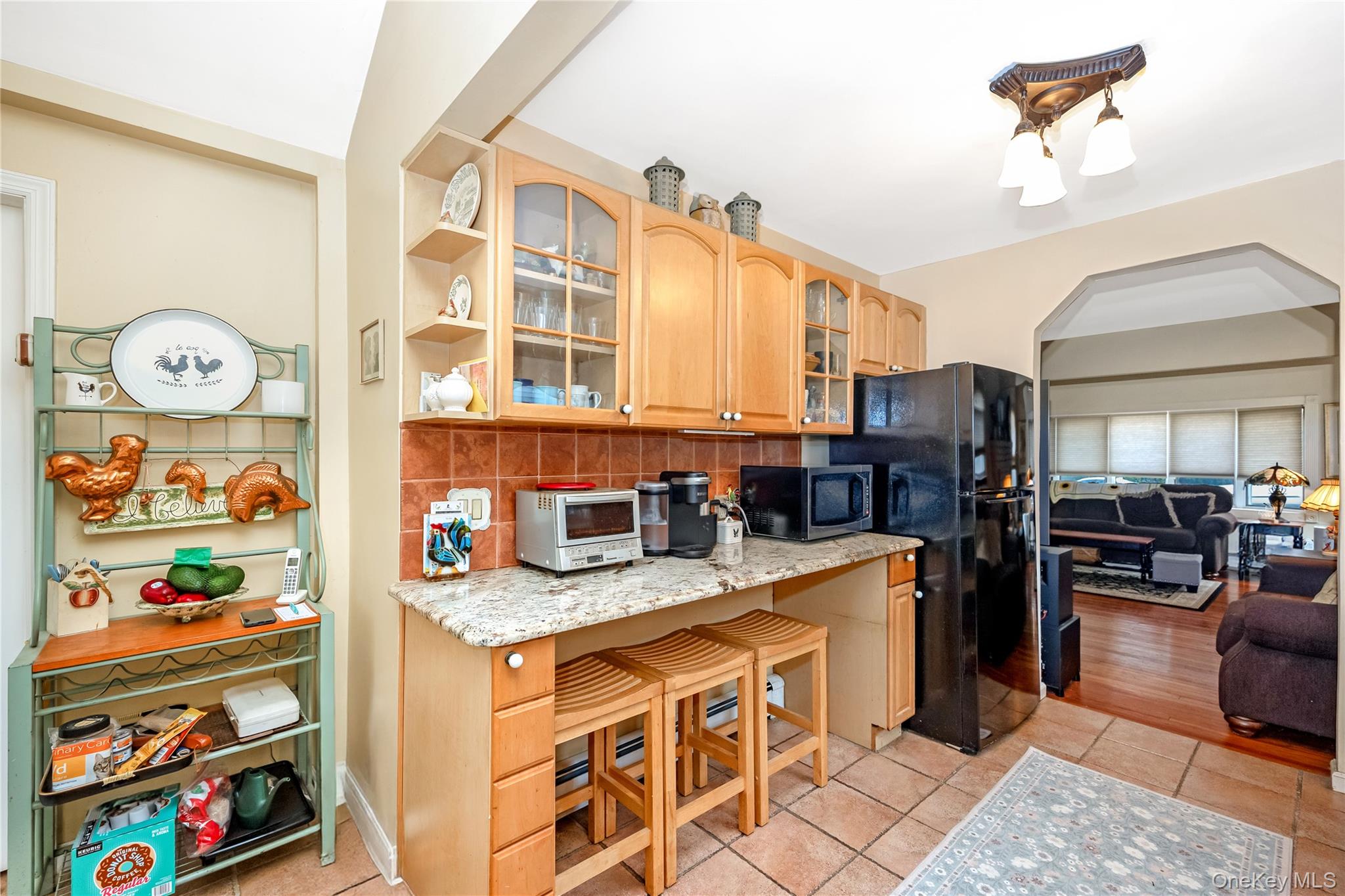 180 Lakeside Trail Ridge, NY 11961 - Photo 9 of 22 a open kitchen with stainless steel appliances granite countertop a stove and a refrigerator