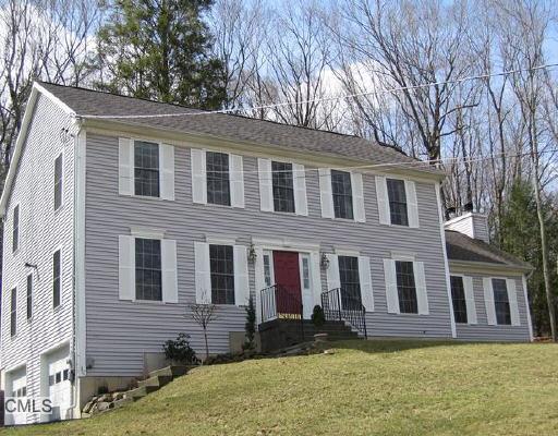 4 Lester Road Newtown, CT 06482 - Photo 1 of 1 a front view of a house with a yard
