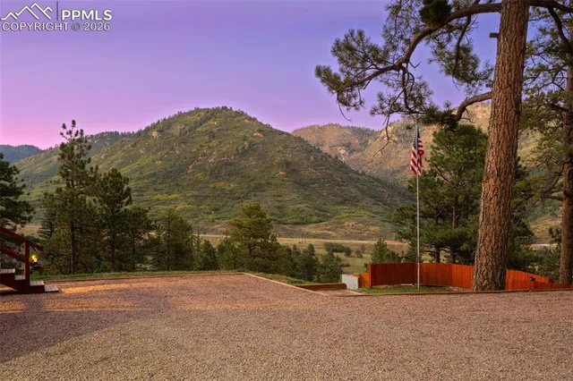 a view of a road with a building in the background