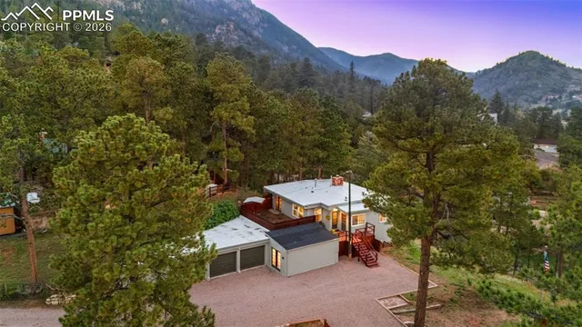 an aerial view of a house with a yard