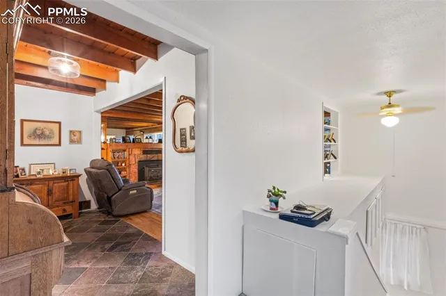 a living room with furniture and a lamp