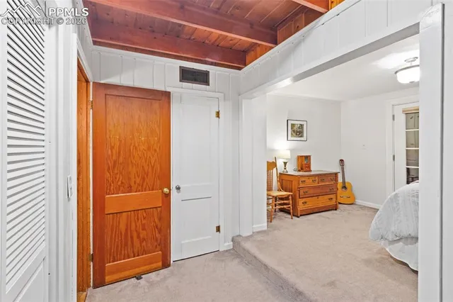 a bedroom with furniture and a window