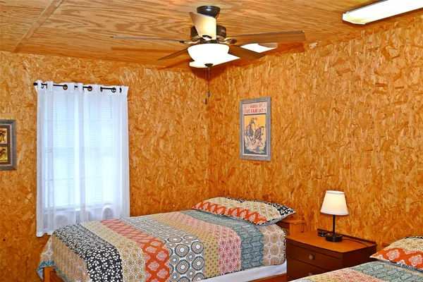a bathroom with a shower curtain and a window