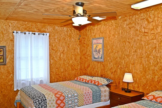 a bathroom with a shower curtain and a window