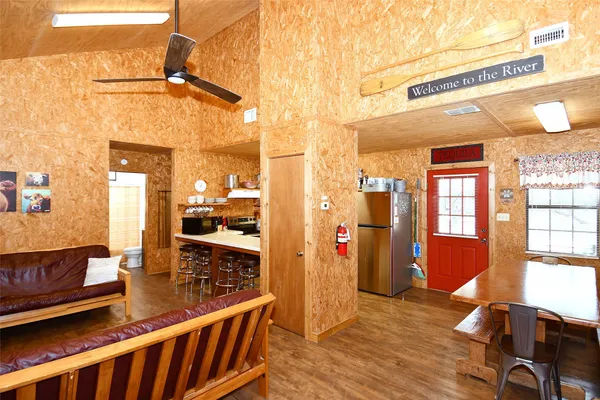 a bedroom with two beds and a chandelier