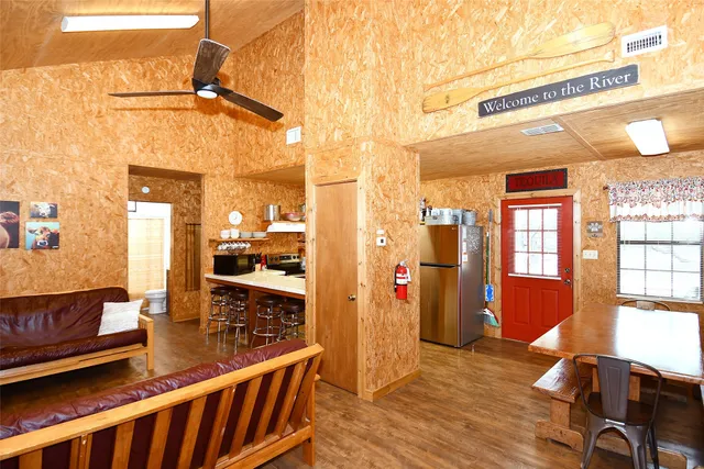 a bedroom with two beds and a chandelier