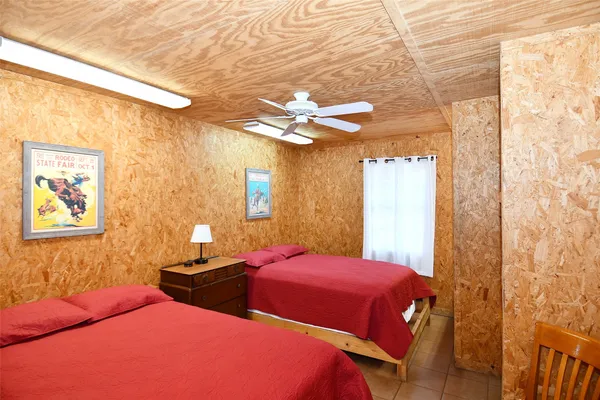 a bathroom with a shower curtain and a window