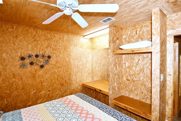 a living room with fireplace furniture and a flat screen tv