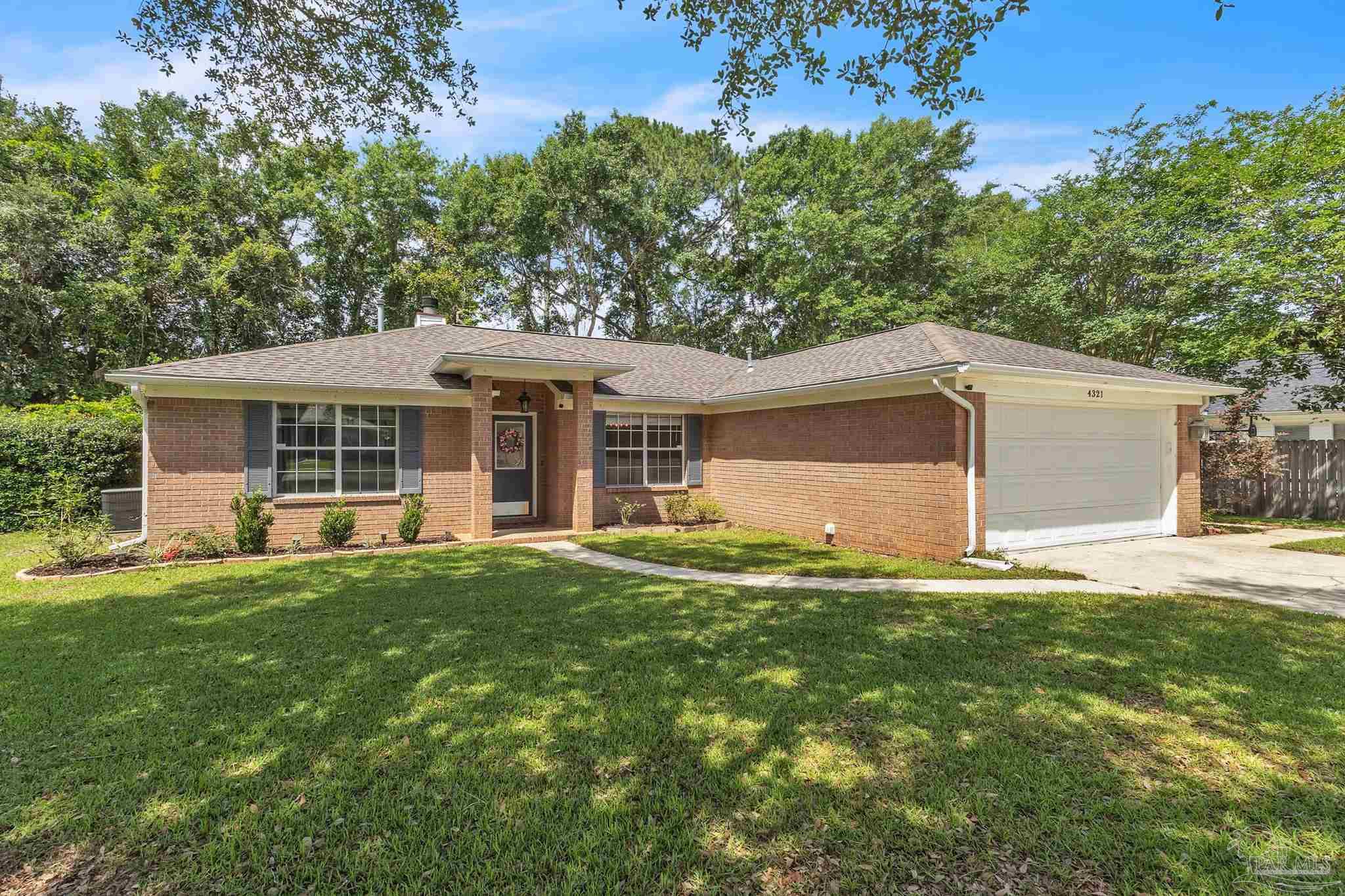 4321 Ridgeland Drive Pace, FL 32571 - Photo 26 of 36 front view of a house with a yard