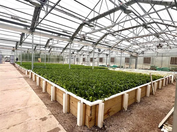 a view of a house with wooden fence