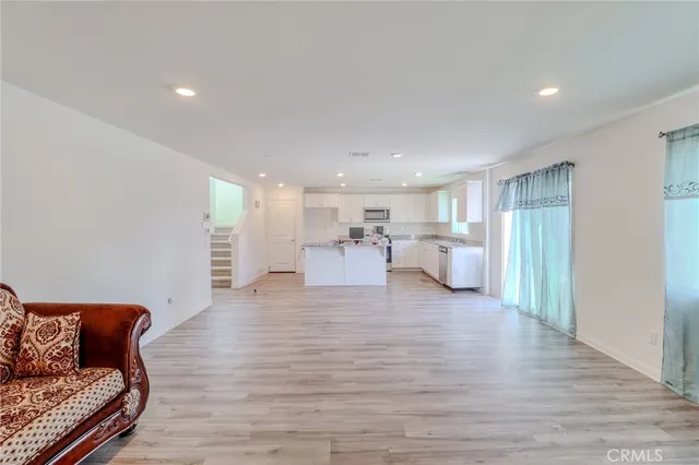 a room with a couch and a potted plant