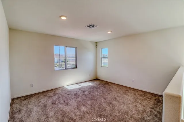 a view of an empty room and closet