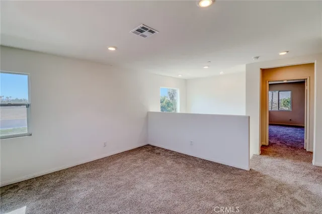 a view of hallway with wooden floor