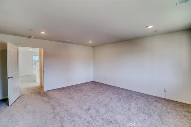 a spacious bathroom with a shower and a toilet
