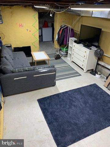 a hallway with chairs and a table