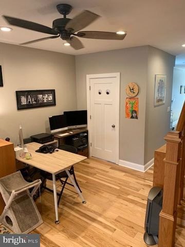 a workspace with furniture and wooden floor