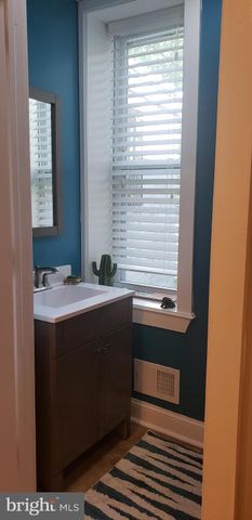 a bathroom with a sink and a window