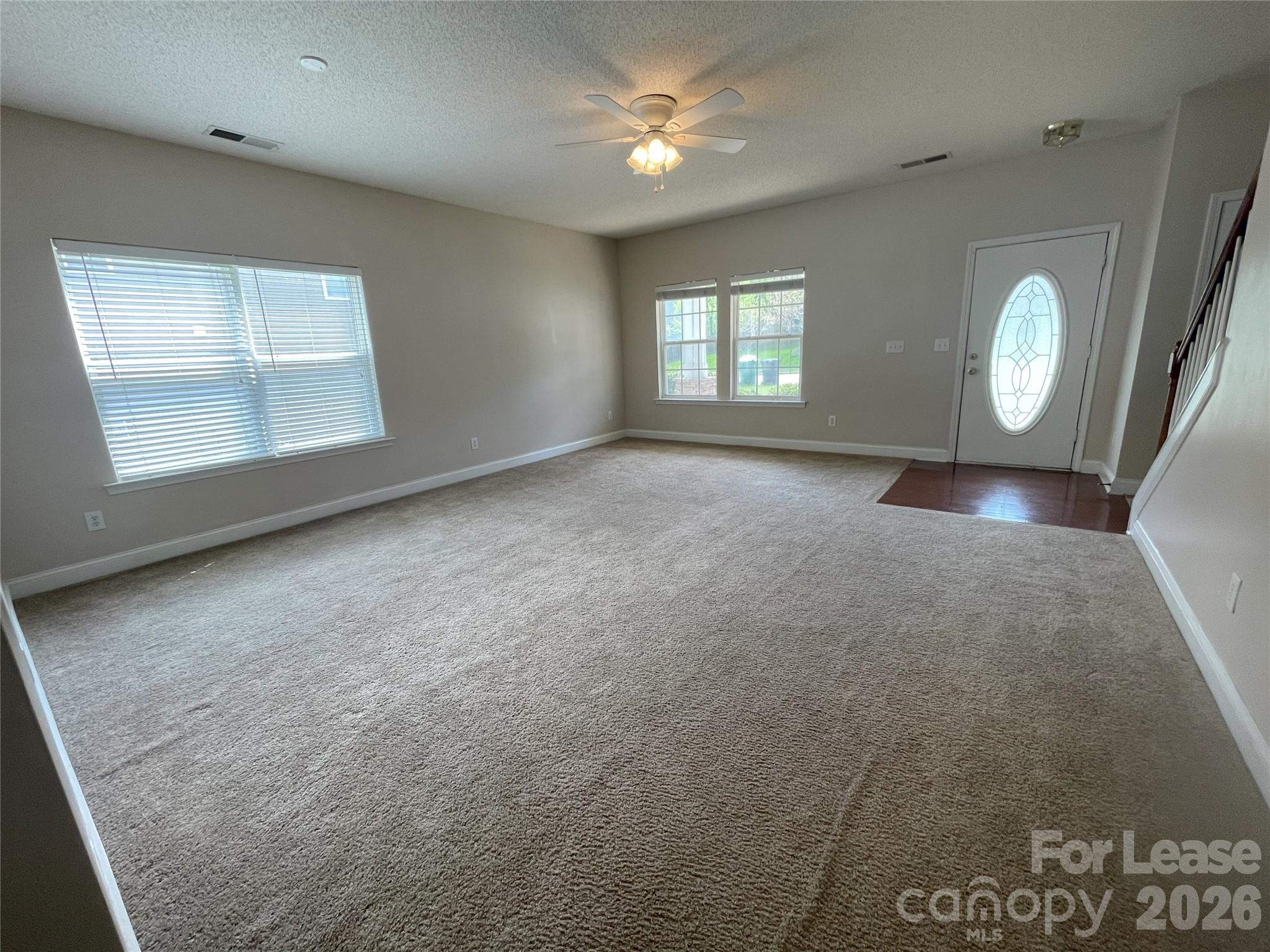 4532 Brookwood Road Charlotte, NC 28215 - Photo 4 of 11 an empty room with windows