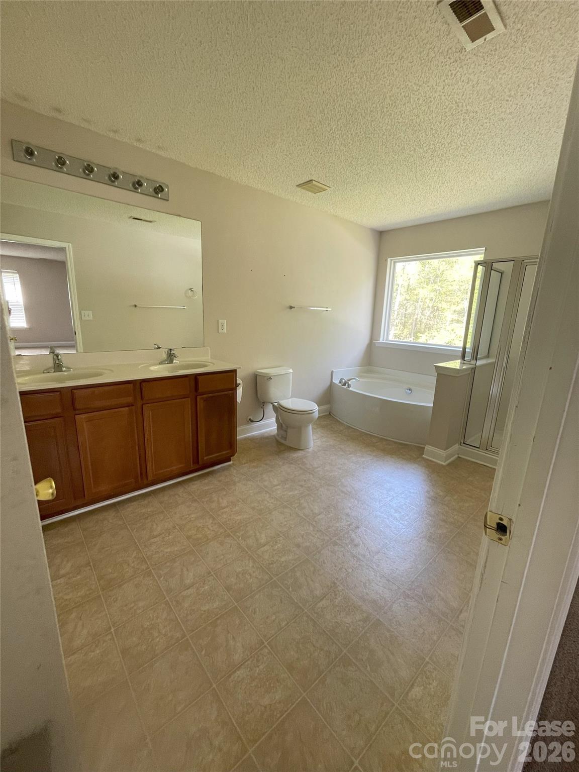 4532 Brookwood Road Charlotte, NC 28215 - Photo 7 of 11 a view of a room with wooden floor and windows