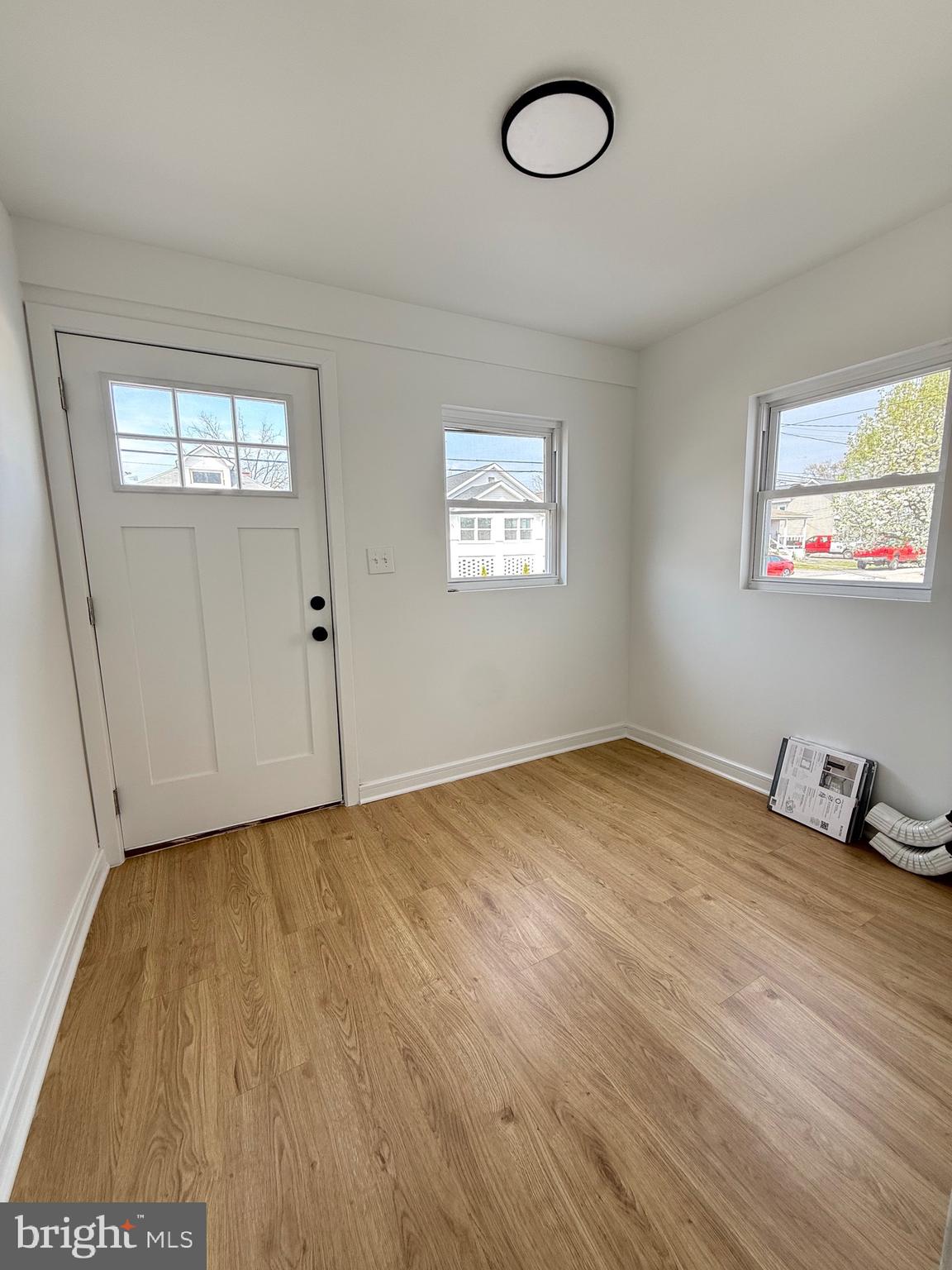 2125 1/2 Oakland Road Baltimore, MD 21220 - Photo 3 of 18 a view of empty room with wooden floor