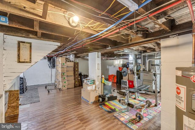 a view of a storage room with wooden floor