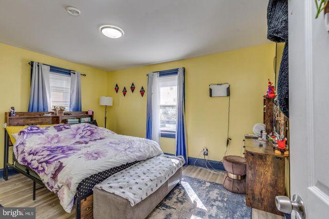 a bed room with a bed and a dresser