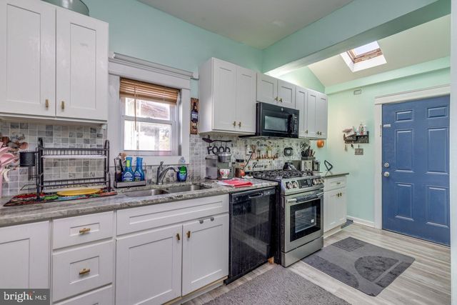 a kitchen with a stove and a sink