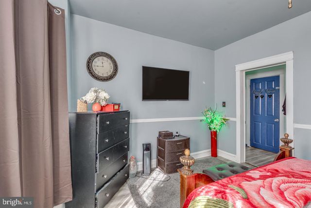 a bedroom with a bed and a tv in it