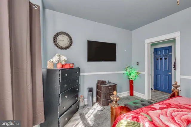 a bedroom with a bed and a tv in it