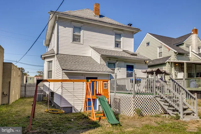a front view of a house with wooden fence