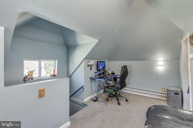 a view of a workspace with furniture