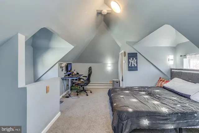 a bed room with a bed and a chair