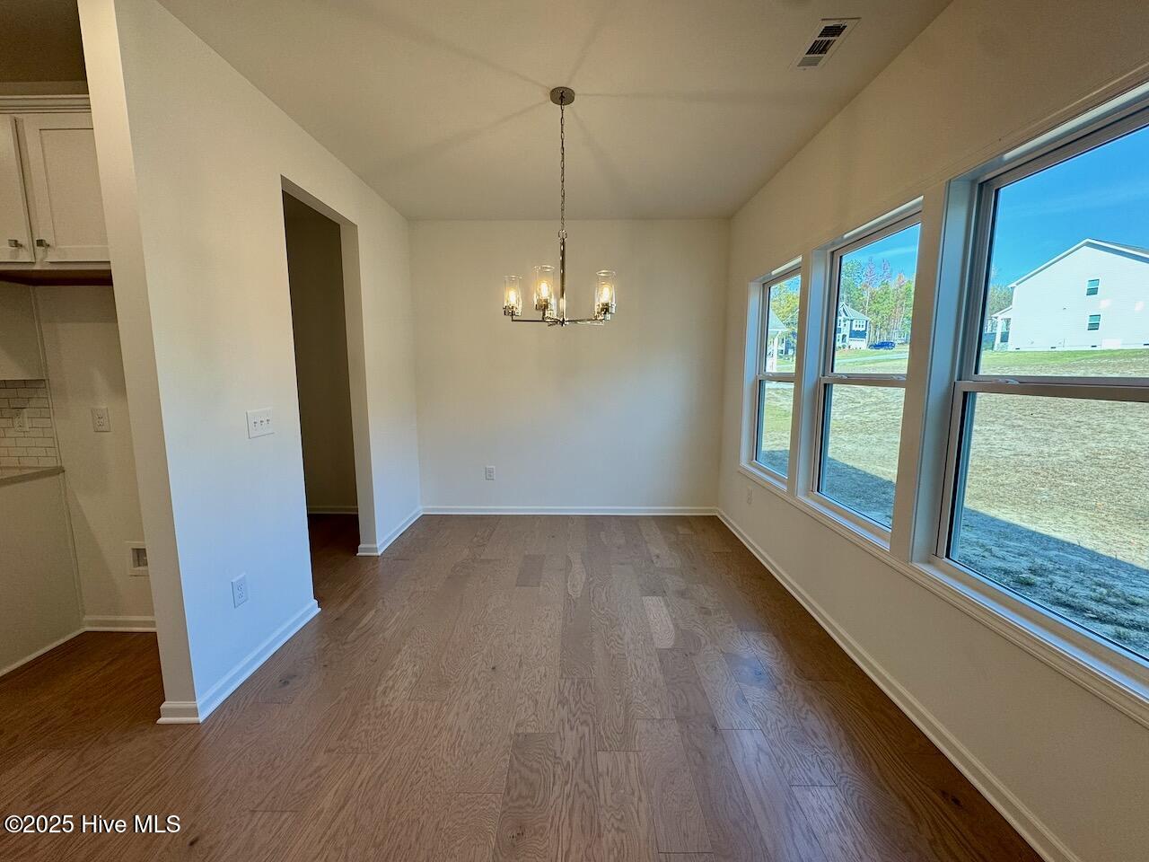 45 Covey Rise Way Lillington, NC 27546 - Photo 15 of 62 HIGHLIGHTS: Pillar Oak-Sand Engineered Hardwood Floors and an Upgraded 24" Polished Nickel Chandelier.