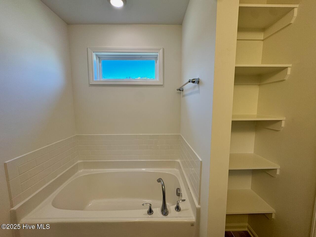 45 Covey Rise Way Lillington, NC 27546 - Photo 33 of 62 HIGHLIGHTS: Soaking Tub and Built-In Shelving in Nook.