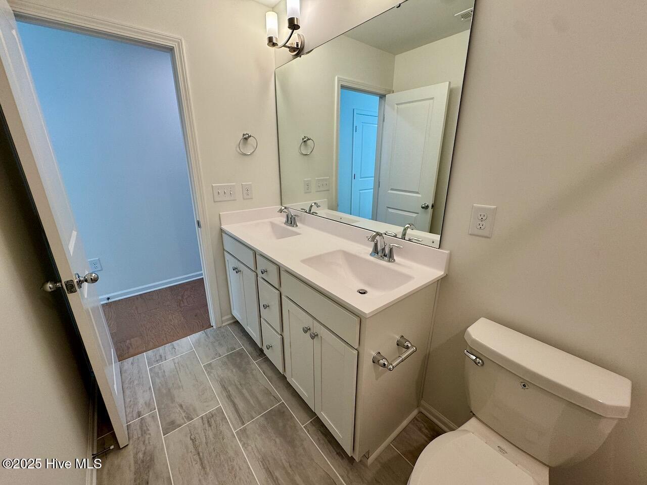 45 Covey Rise Way Lillington, NC 27546 - Photo 48 of 62 HIGHLIGHTS: Costar Mount Claire Ash-Rectangle 1/2 Staggered Brick Pattern Tile Floor, Double Vanity with a Frameless Mirror, Upgraded Polish Nickel Lights, Faucet, and Cabinet Hardware, Disk Lighting, and a Combo Shower/Tub.