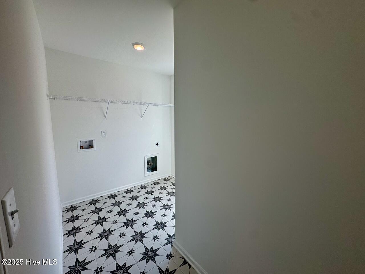 45 Covey Rise Way Lillington, NC 27546 - Photo 49 of 62 HIGHLIGHTS: Memoir – Jewel Black Tile on Floor with Frost Grout, Wire Shelving, and Washer/Dryer Hook-up. CONVENIENTLY LOCATED ON THE SECOND FLOOR!