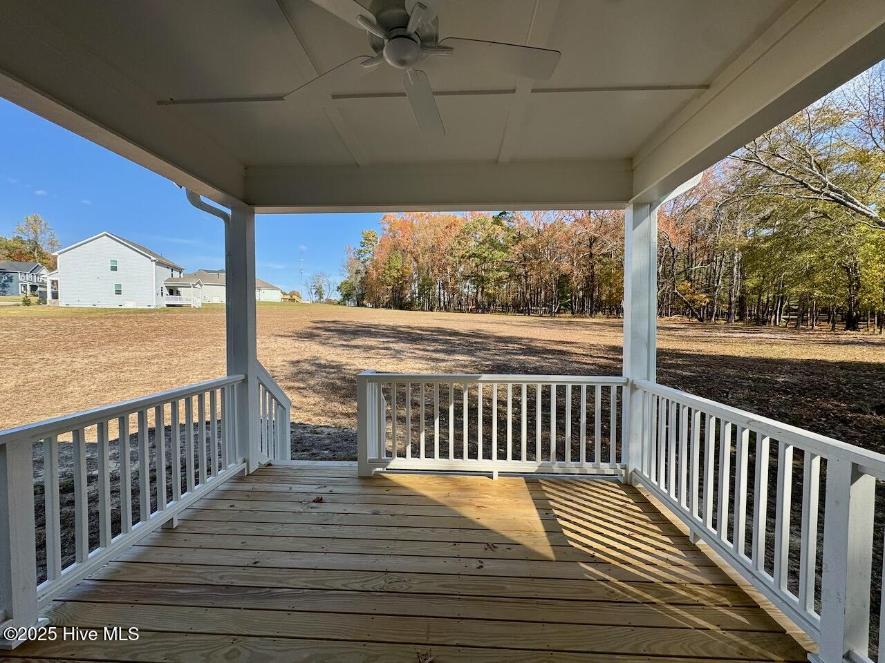 45 Covey Rise Way Lillington, NC 27546 - Photo 53 of 62 HIGHLIGHTS: Covered, Pressure Treated Wood Floors, Columns, and Railings, (Columns and Railings are also painted), Flood Light, and Upgraded Outdoor Ceiling Fan.