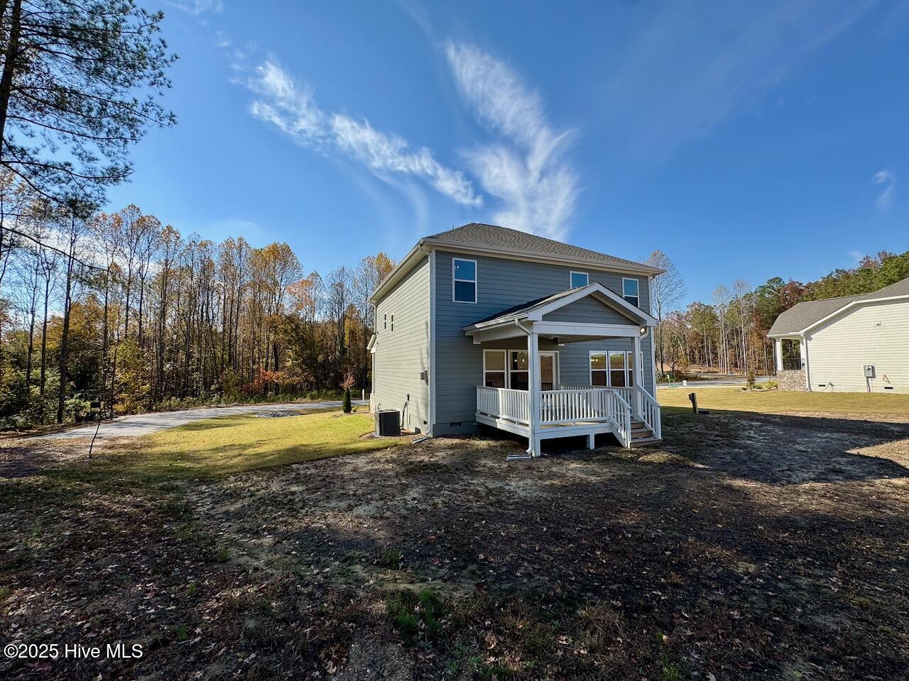 45 Covey Rise Way Lillington, NC 27546 - Photo 58 of 62 HIGHLIGHTS: Fiber Cement Siding, Board & Batten, and Trim, with Winter Point Weather Ledge Stone, 30-yr Architectural Shingles, Low-E Double Pane Windows, Composite Shutters, and a Covered front Deck.