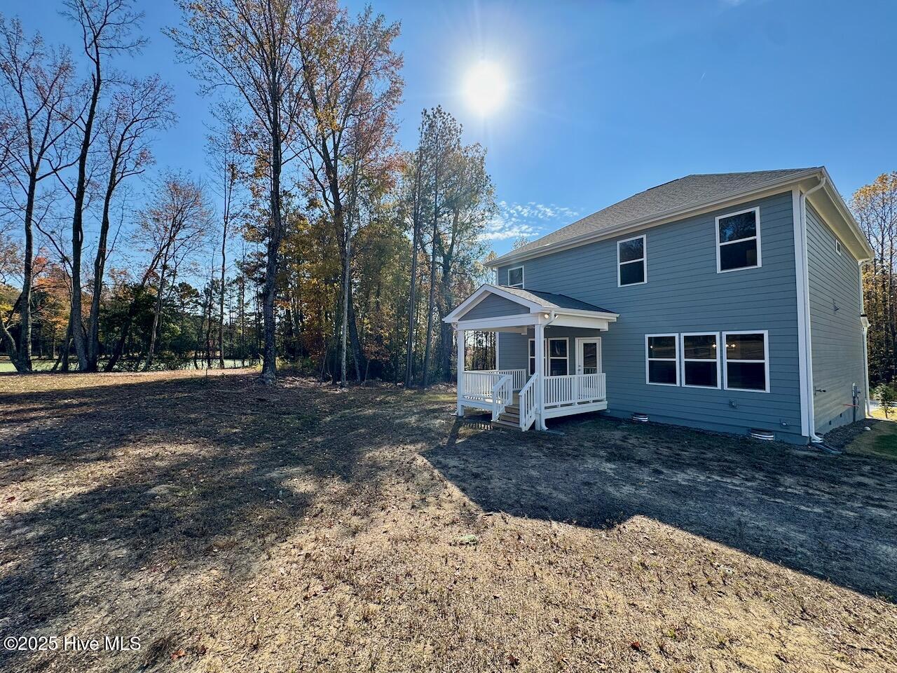 45 Covey Rise Way Lillington, NC 27546 - Photo 59 of 62 HIGHLIGHTS: Fiber Cement Siding, Board & Batten, and Trim, with Winter Point Weather Ledge Stone, 30-yr Architectural Shingles, Low-E Double Pane Windows, Composite Shutters, and a Covered front Deck.