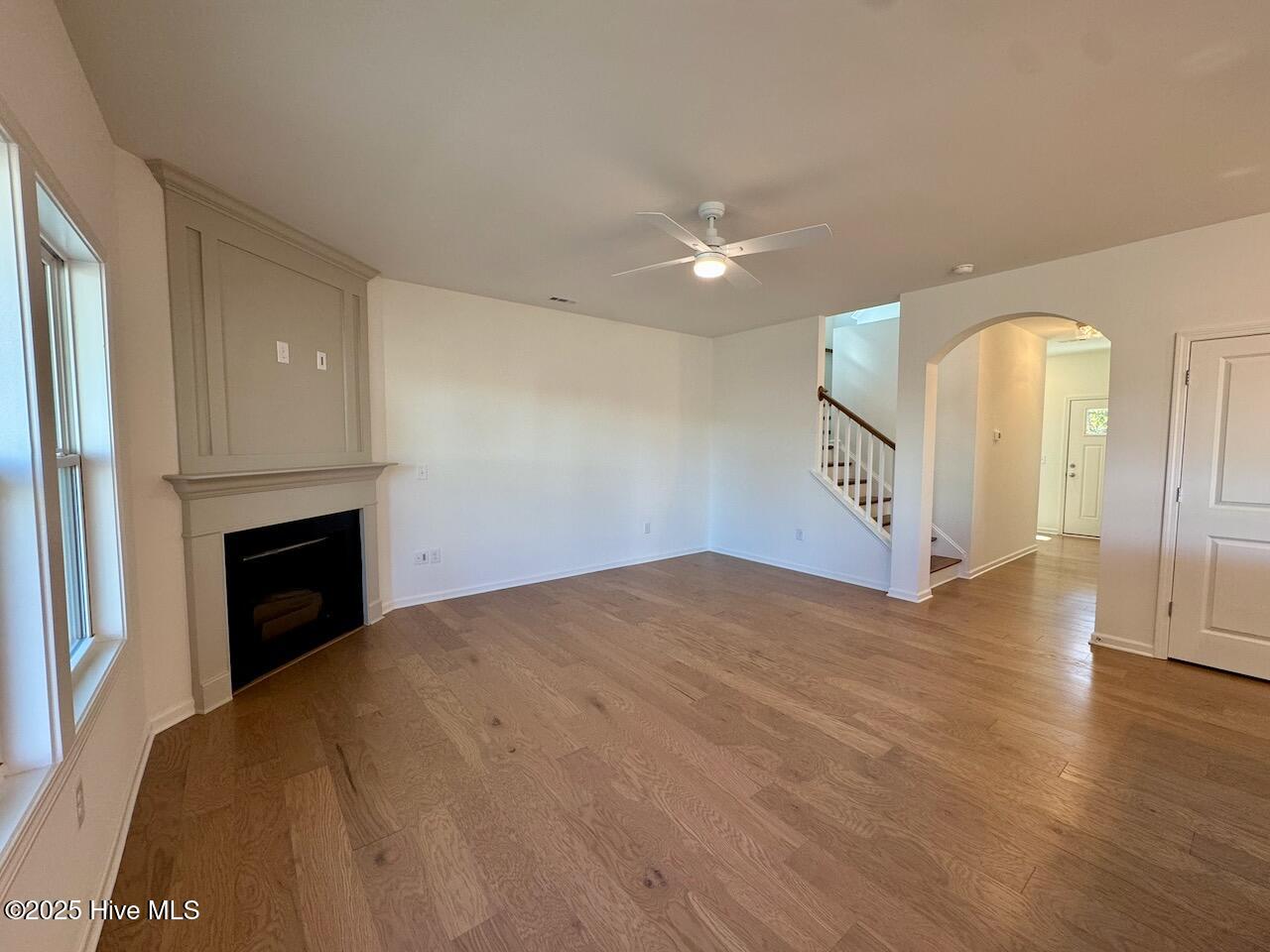 45 Covey Rise Way Lillington, NC 27546 - Photo 7 of 62 HIGHLIGHTS: Pillar Oak-Sand Engineered Hardwood Floors, Ceiling Fan, and Gas Log Fireplace with Surround and Mantle with Trim Work.