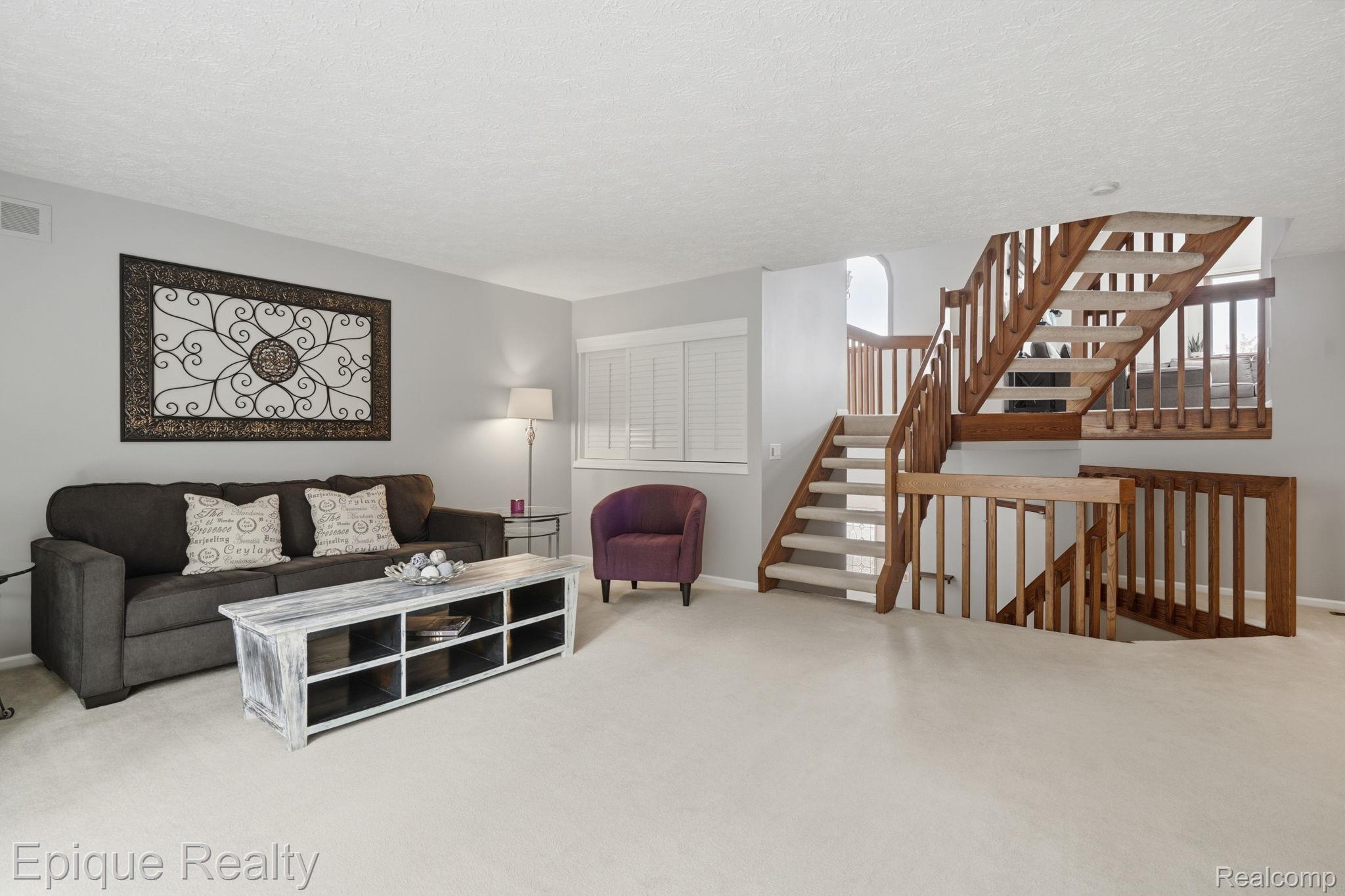 6607 Ridgeview Drive Clarkston, MI 48346 - Photo 15 of 25 Living room featuring carpet and a textured ceiling