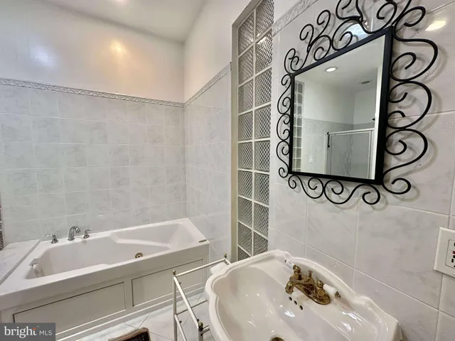 a bathroom with a toilet and shower