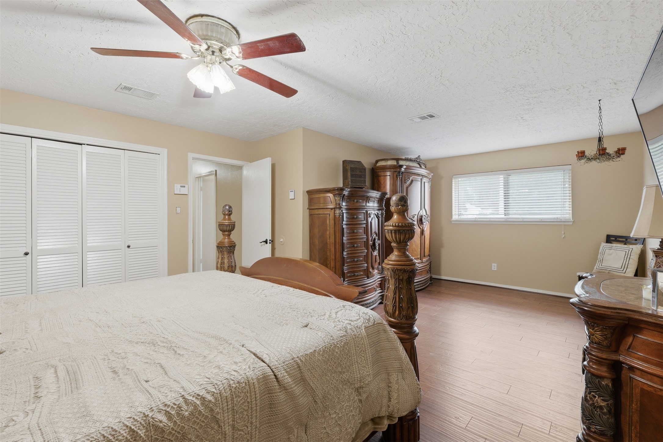 7010 River Mill Drive Spring, TX 77379 - Photo 20 of 29 a bed room with a bed and a ceiling fan