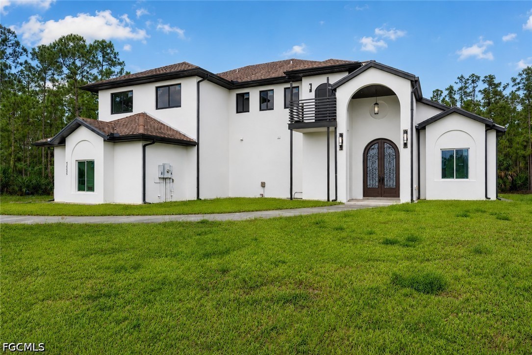 a front view of a house with garden
