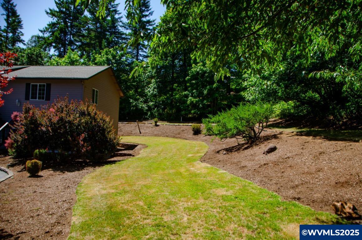 16870 Selden Road Dallas, OR 97338 - Photo 24 of 42 a view of a house with a yard