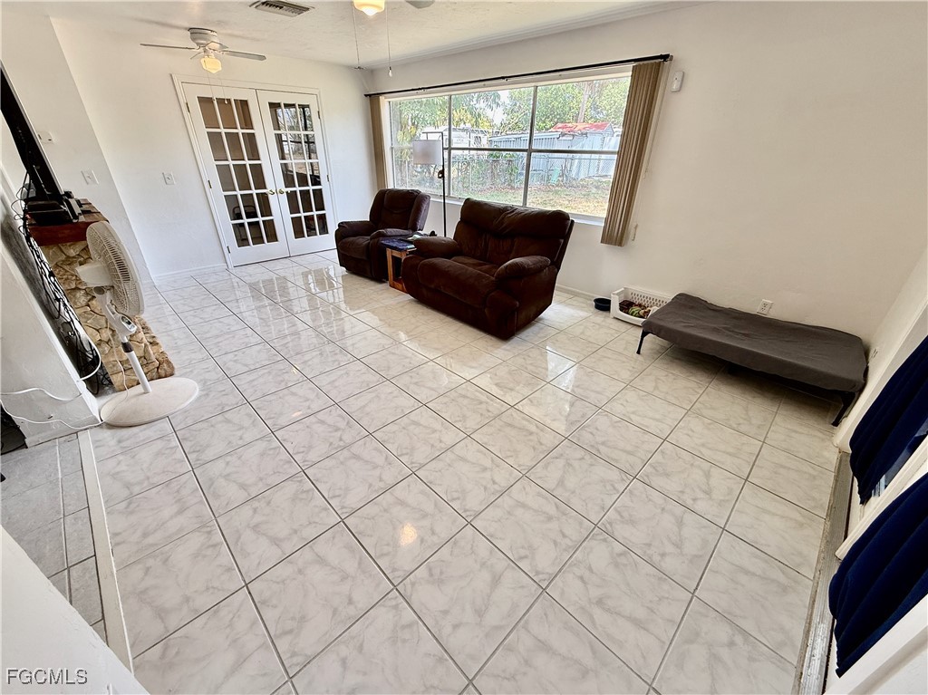 314 Vermont Way Lehigh Acres, FL 33936 - Photo 15 of 45 a living room with furniture and a window